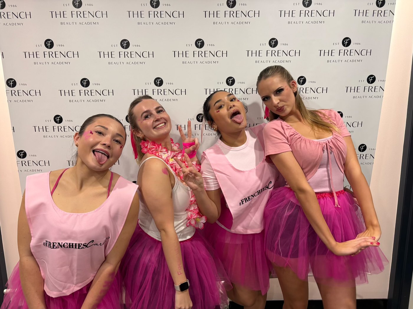 Emma and fellow students in pink tutus at the Frenchies Care fun run, The French Beauty Academy